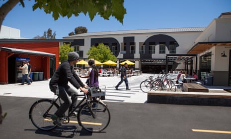 Facebook employees traverse the company’s campus. 