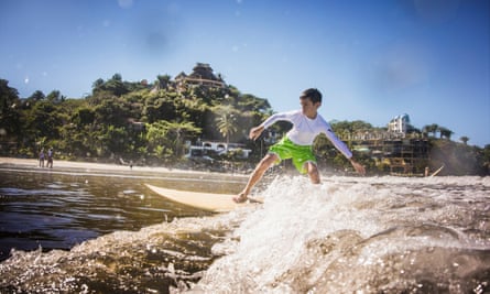 Boy surfing in ocean Sayulita