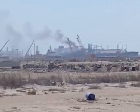 Smoke rises from a gas tanker at Damietta port in Egypt