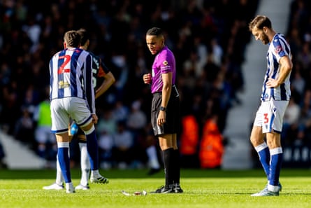 Players look at the peregrine’s lunch …