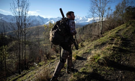 A hunter walking during a deer hunt in the Pyrenees.