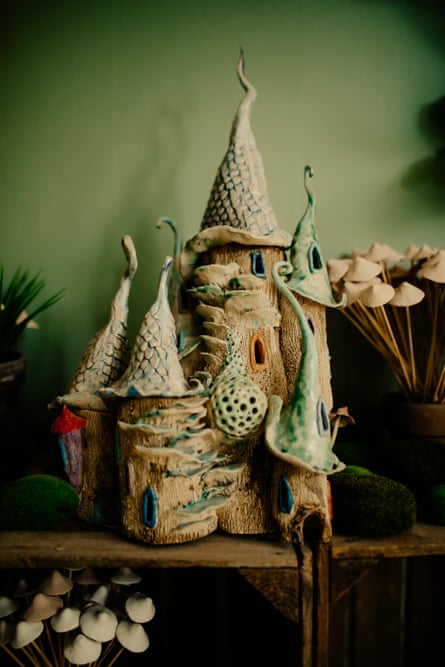 A pottery fairy house with crooked turrets.