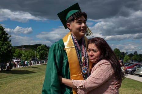 a woman hugging a young man