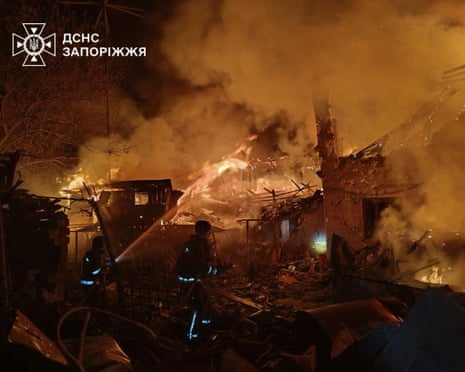 Firefighters work at the site of buildings hit during the Russian missile strike, amid Russia's attack on Ukraine, in Zaporizhzhia, Ukraine.