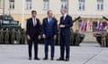 Rishi Sunak, left, Poland's prime minister, Donald Tusk, and the Nato secretary general, Jens Stoltenberg, at a military barracks in Warsaw, Poland.