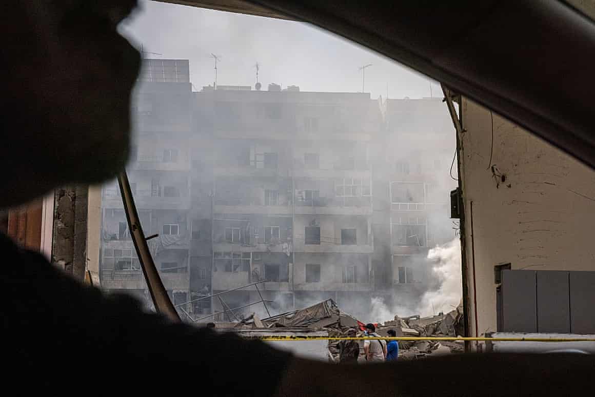 Smoke rises from an apartment building