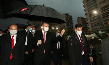 Turkey’s president, Recep Tayyip Erdoğan, centre, with the Turkish Cypriot politician Ersin Tatar, left, visit the controversially reopened resort of Varosha.