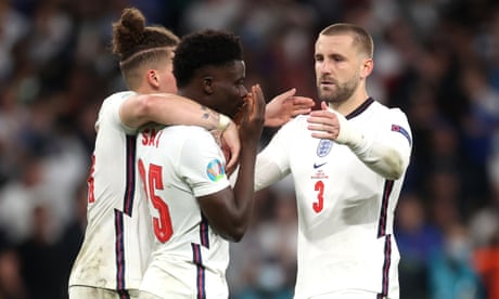 Luke Shaw (right) joins Kalvin Phillips in consoling Bukayo Saka after England’s defeat on penalties against Italy in the Euro 2020 final.