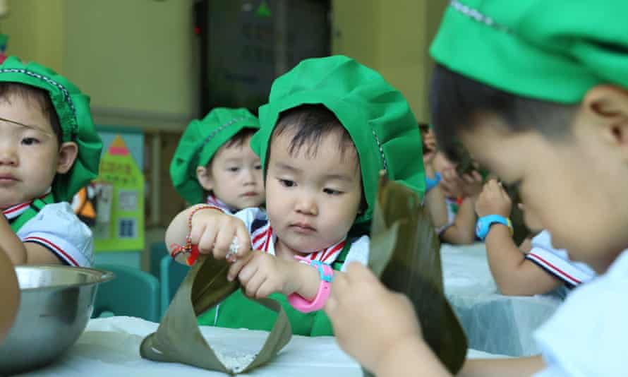 Children make dumplings