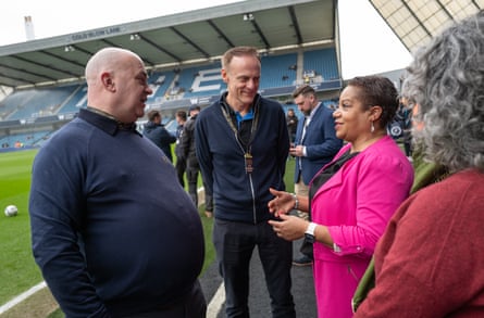 The politician of Lewisham, Dame Brenda Dacres, chats to Micky Simpson, a Millwall podcaster and erstwhile instrumentality connected nan board, and Barney Ronay.