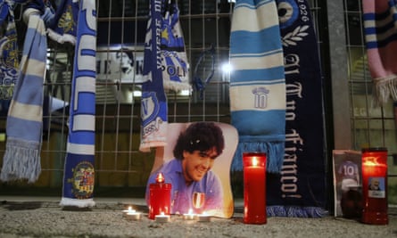 Candles and scarves lie next to a picture of legend Diego Maradona outside the San Paolo Stadium in Naples.