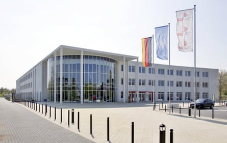 A modern grey, glass-fronted school building
