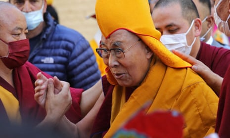 The Dalai Lama (centre) arrives to attend a prayer at the main Tibetan temple in McLeod Ganj, India, last month