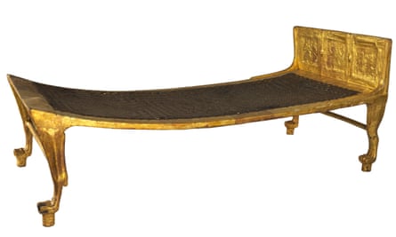 A gilded wooden bed