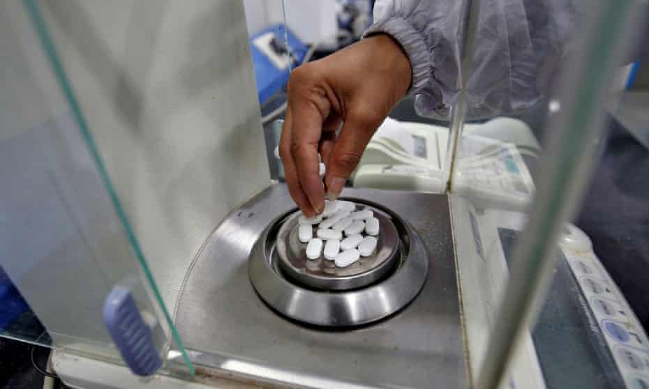 A pharmacist checks paracetamol tablets