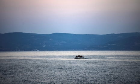 An inflatable boat carrying refugees approaches the Greek island of Lesbos, on 2 March 2020.