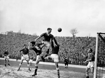 Bobby Charlton rises above United team-mate Liam Whelan and Addicks keeper Willie Duff on his way to a first hat-trick in league football as John Hewie (left) and Trevor Edwards look on 19th February 1957.