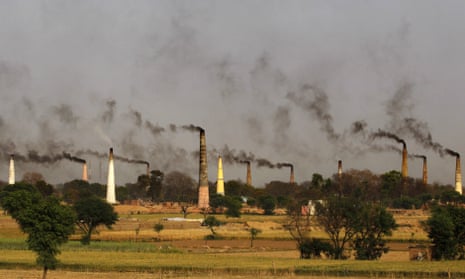 Smoke rises from brick kiln chimneys on the outskirts of New Delhi, India. The city last year earned the dubious title of being the world s most polluted city.