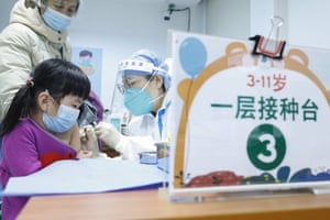 A child receives a dose of Covid-19 vaccine at a vaccination site in Beijing.
