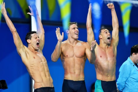 Mitch Larkin, Jake Packard, and Grant Irvine celebrate after winning the men’s 4x100m medley relay final.