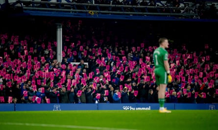 Everton fans hold signs protesting against the Premier League