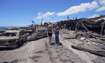 Hawaii governor Josh Green (L) and Maui county mayor Richard Bissen, Jr. survey the damage in Lahaina on Saturday.