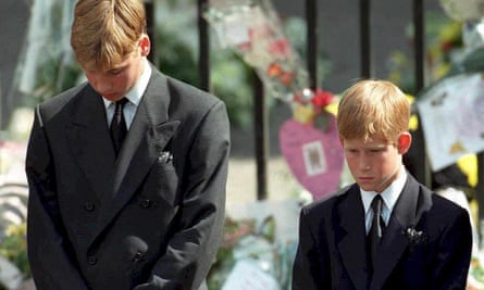 Harry (right) and Prince William bow their heads as their mother’s coffin is taken out of Westminster Abbey following her funeral service in 1997