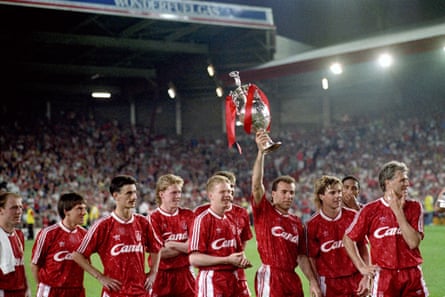 Liverpool’s Ronny Rosenthal holds aloft the Division One championship trophy in 1990.