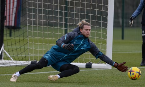 Loris Karius dives to make a save during a Newcastle training session.