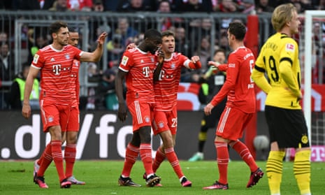 Bayern Munich's Dayot Upamecano celebrates scoring their first goal with his teammates.