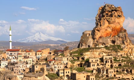 Ortahisar in Cappadocia with the inactive volcano Erciyes in the background.