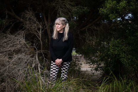 Vera Gazzard, who has long blonde hair and is wearing black and white, standing in shrubland  at Torquay, Victoria