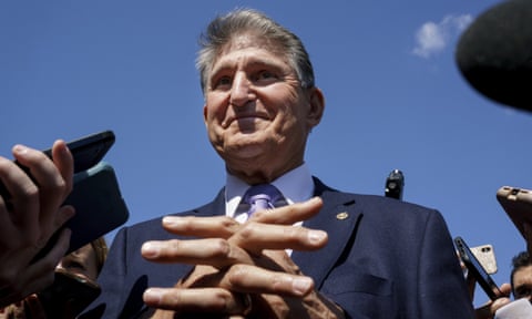 Joe Manchin, a centrist Democrat vital to the fate of President Joe Biden's $3.5 government overhaul, updates reporters about his position on the bill, at the Capitol in Washington, Thursday, Sept. 30, 2021. (AP Photo/J. Scott Applewhite, File)