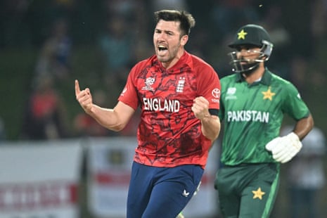 England's Jamie Overton (L) celebrates after taking the wicket of Pakistan's Sahibzada Farhan.