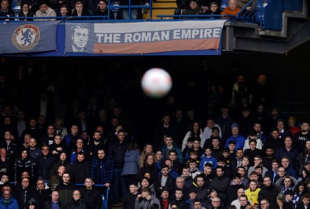 Chelsea fans watch the match under a banner celebrating Roman Abramovich during the Premier League match between Chelsea and Newcastle United at Stamford Bridge.