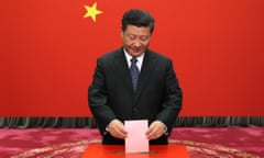 Xi Jinping casts his ballot at a voting booth during a local people’s congress election in 2016