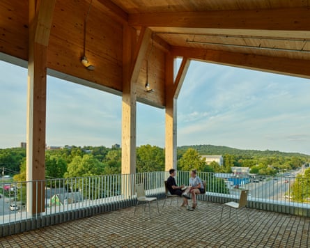An end-grain cobbled terrace with views of the forest.