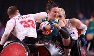 Shae Graham of Australia attempts to evade the challenge of France’s Sebastien Verdin and Corentin Le Guen.