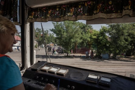 Ludmyla Osadchuk drives the tram delivering clean water around Mykolaiv.