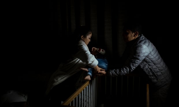Masuma and Noor place Diana in her crib