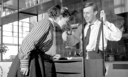 Shirley Conran with Terence looking at a new shelving design