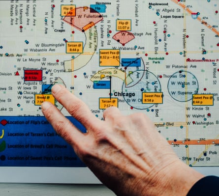 A hand pointing on a screen showing cell tower mapping