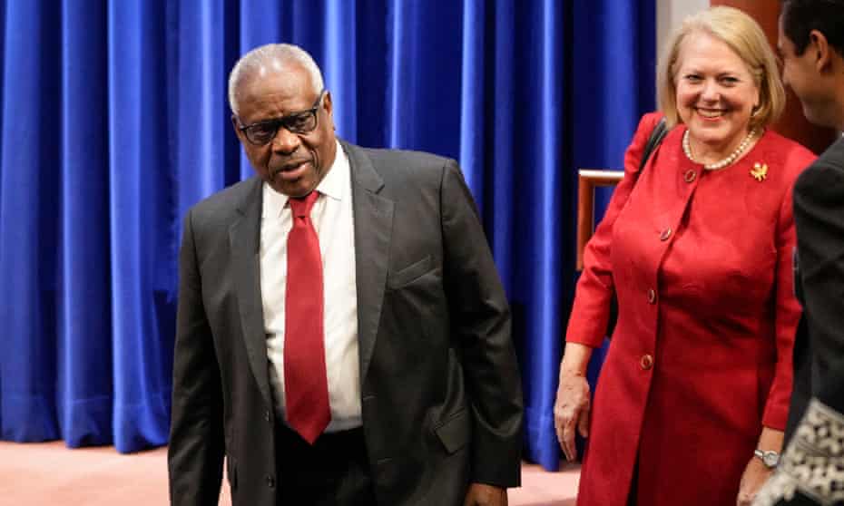 Ginni Thomas with her husband the supreme court justice Clarence Thomas, left.