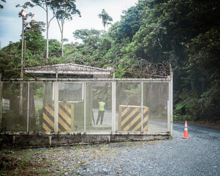 A staffed entry gate on a forest road