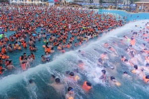 People cool off at a swimming pool in Fuyang, Anhui Province, China, in 2016