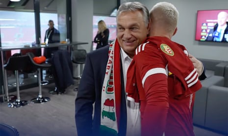 Hungary’s prime minister, Viktor Orbán, wearing a football scarf showing Hungary’s pre-world war one borders, which included parts of Ukraine and Romania among others.