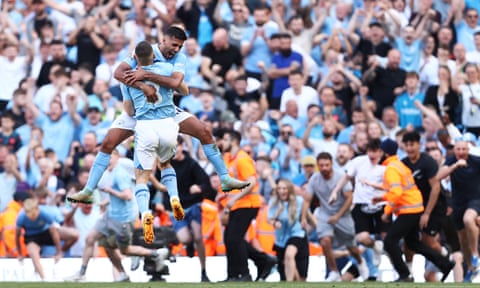 Rodri (top) and Kyle Walker embrace as Manchester City fans invade the pitch.