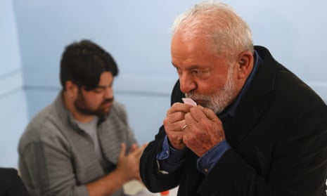 Former Brazilian President Luiz Inacio Lula da Silva kisses his voting receipt in Sao Paulo, Brazil.