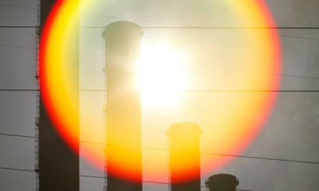 Sun is seen rising behind funnels of brown coal Hazelwood power station in Latrobe Valley