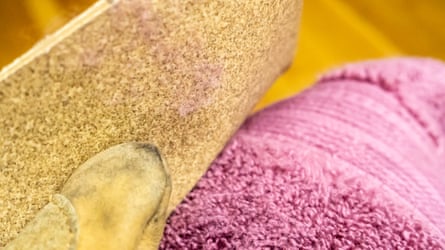 A Charisma Towel being rubbed with sandpaper